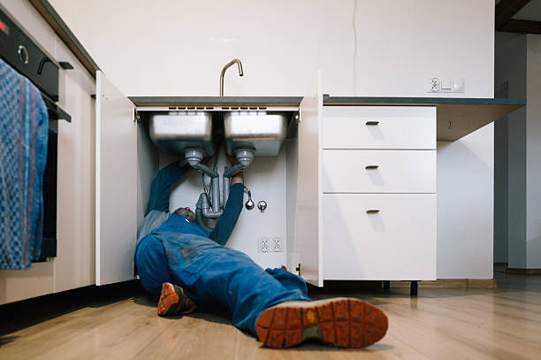 Professional Drain Cleaning technician working in Earlham, IA